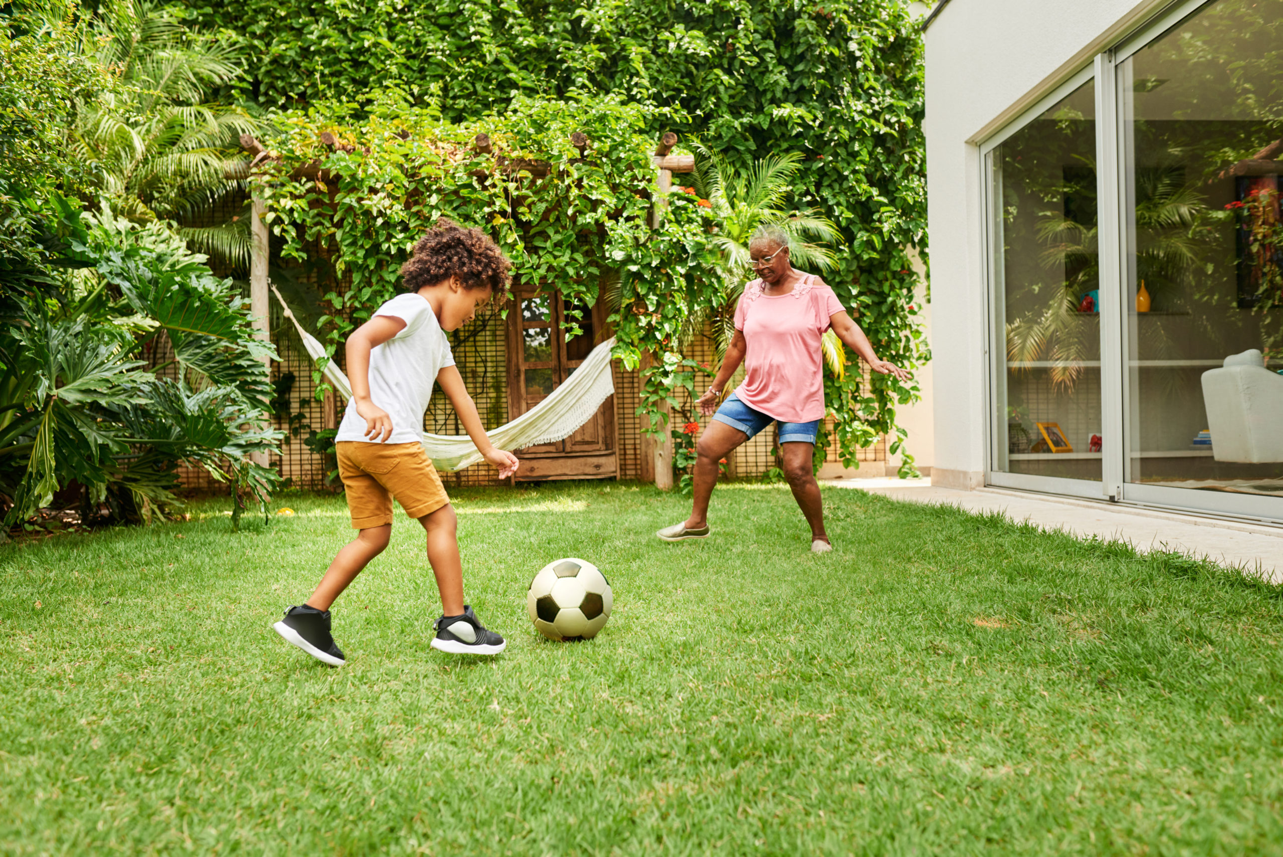 Image of Boy Playing Soccer with Grandmother | Strength Training For Women