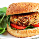 Hearty black beans and brown rice fortify these bean burgers feature fresh onion, basil, and grated Parmesan cheese for a flavorful vegetarian burger.