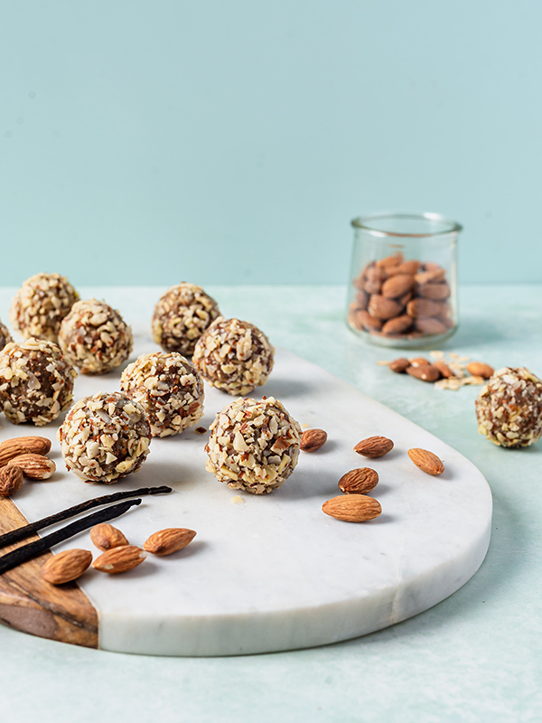 Vanilla Almond Energy Balls on marble cutting board