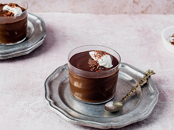 Chocolate Shakeology Pudding in a glass cup on silver tray | dessert recipes