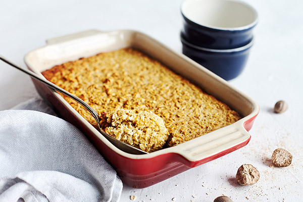 This easy oven Baked Oatmeal recipe features old-fashioned rolled oats, raw honey, and unsweetened applesauce for a touch of natural sweetness.