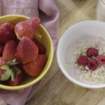This healthy Swiss Oatmeal breakfast features creamy almond milk, old-fashioned rolled oats, reduced-fat Greek yogurt, and is topped with fresh fruit.