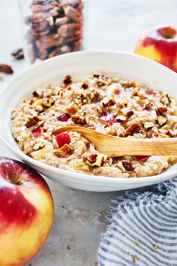 The warm flavors of this Oatmeal Recipe are an excellent way to change up your morning routine with freshly chopped apples, cinnamon, and crunchy pecans.