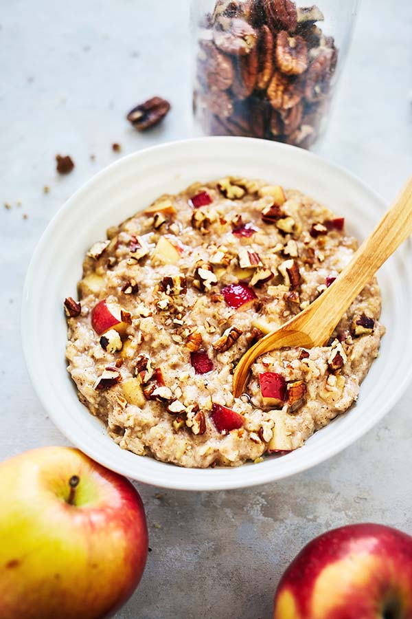 The warm flavors of this Oatmeal Recipe are an excellent way to change up your morning routine with freshly chopped apples, cinnamon, and crunchy pecans.