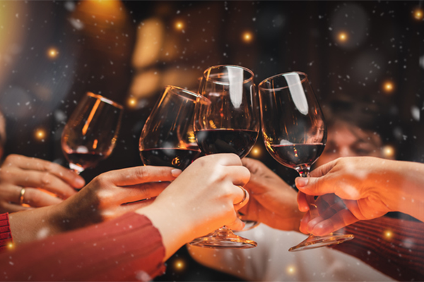 cheers with glasses of wine | Holiday Food Calories