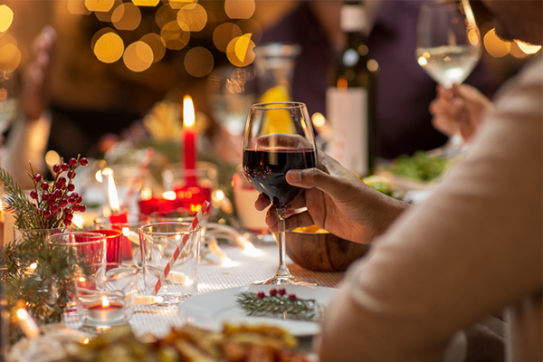 close up of wine glass at christmas table