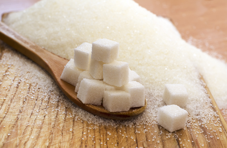 Spoon Full of Sugar Cubes on Table | Best Sports Drink