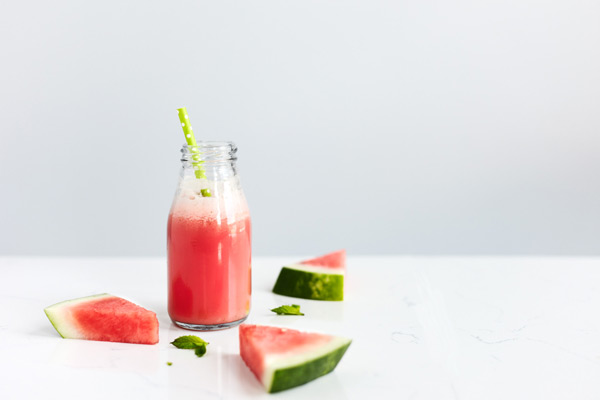 This Minty Watermelon Shakeology smoothie featuring freshly chopped mint and juicy watermelon makes a refreshing afternoon snack.