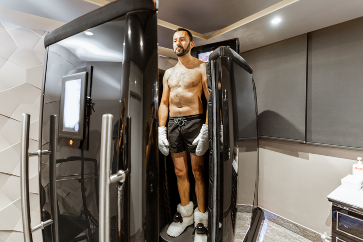 man in cryotherapy chamber | Cryotherapy