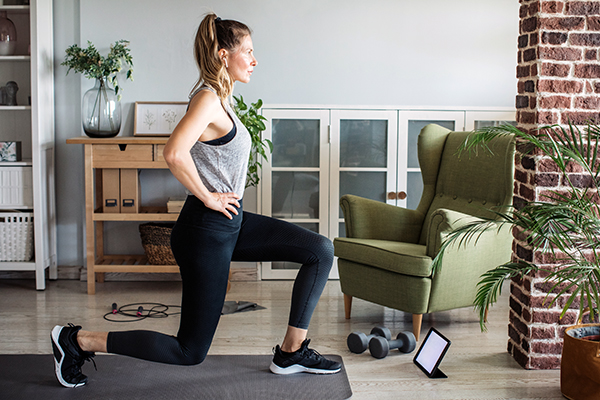 Women at home doing workout.