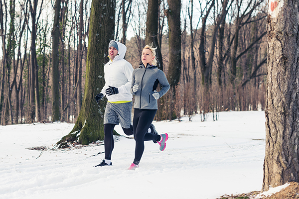 Couple running outside winter