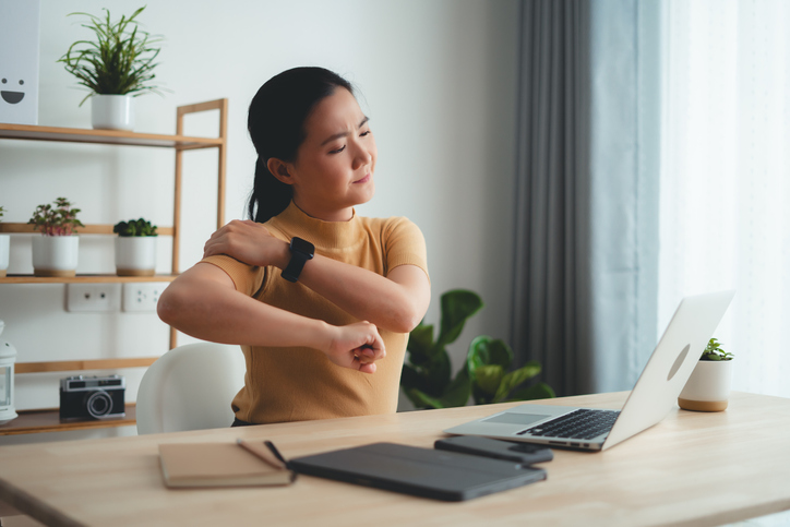 woman massaging shoulder | Lactic Acid