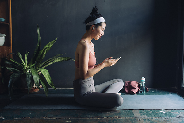 Woman doing guided meditation on her phone