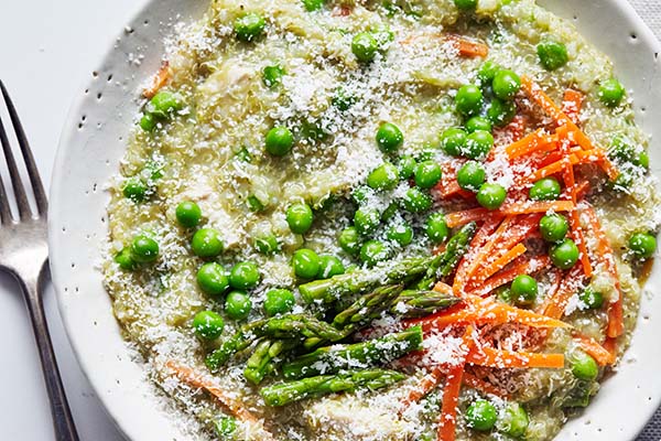 This Slow Cooker Chicken recipe features quinoa, spring vegetables, and tender chicken breast for a light but hearty weeknight dinner.