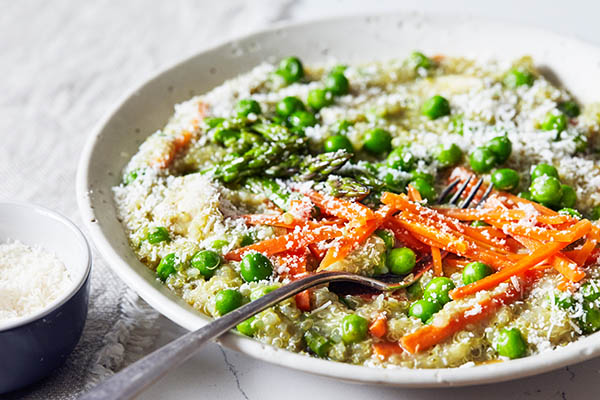 This Slow Cooker Chicken recipe features quinoa, spring vegetables, and tender chicken breast for a light but hearty weeknight dinner.