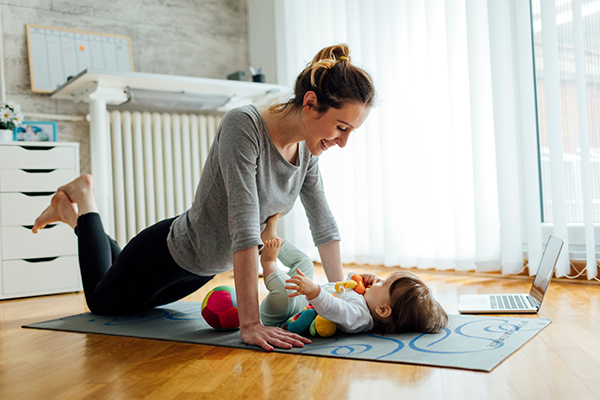 woman exercising with baby
