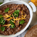 These delicious slow cooker refried beans combine onion, garlic, salt, pepper, and a dash of heat and freeze well for later too!