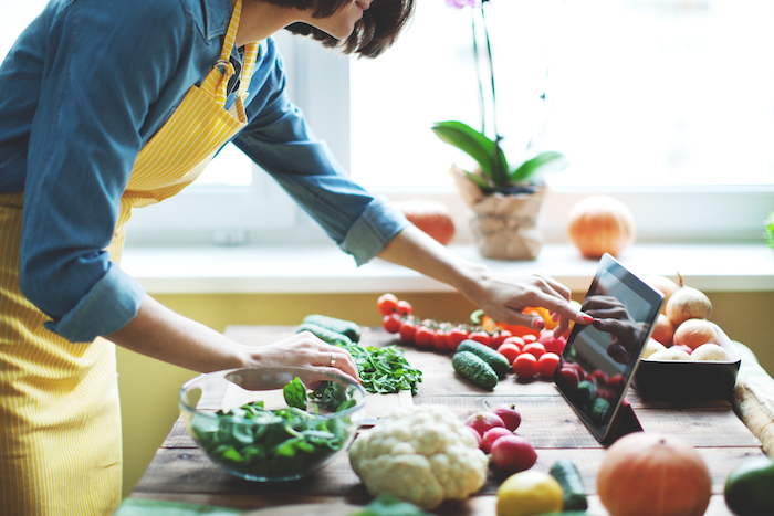 woman chopping veggies | Rest Day