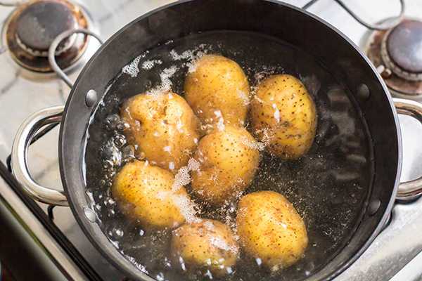Potatoes boiling in a saucepan