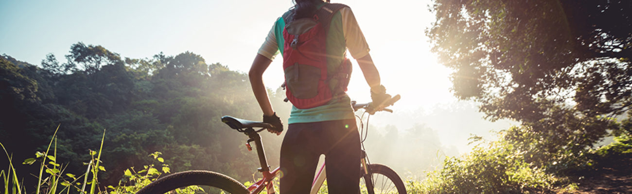 Woman cyclist with her bike