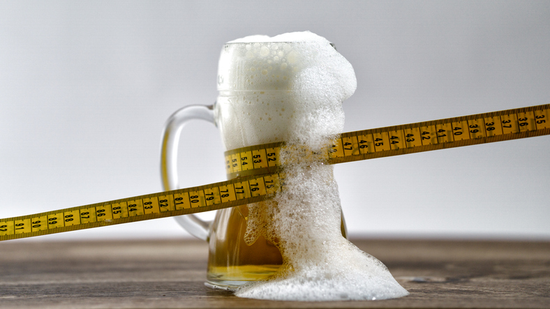 Tape Measure Wrapped Around Mug of Beer | Alcohol on a diet