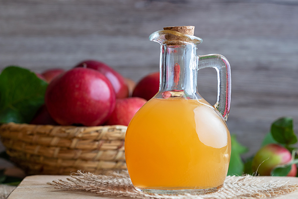 A bottle of raw unfiltered apple cider vinegar