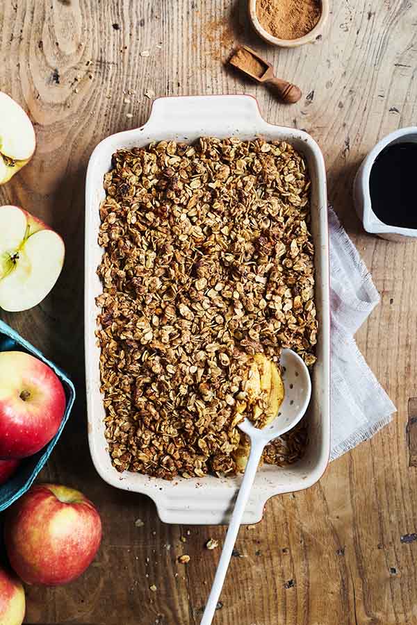 This authentic savory apple crisp dessert features the rich flavor of baked apples, walnuts, oats, and a touch of maple syrup.