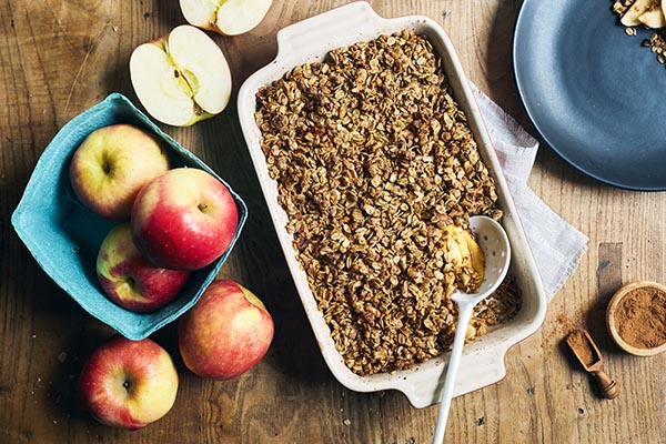 This authentic savory apple crisp dessert features the rich flavor of baked apples, walnuts, oats, and a touch of maple syrup.