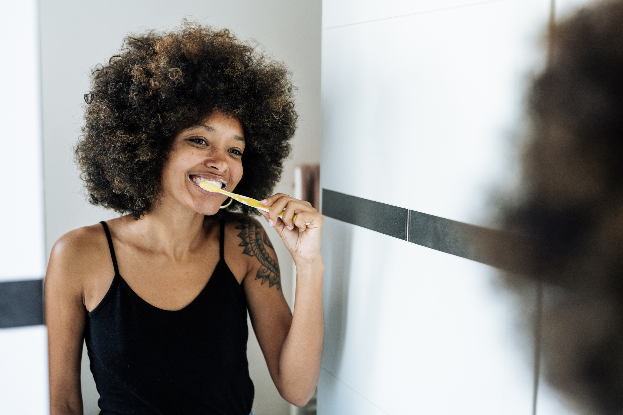 Image of Woman Brushing Teeth | Halloween Candy