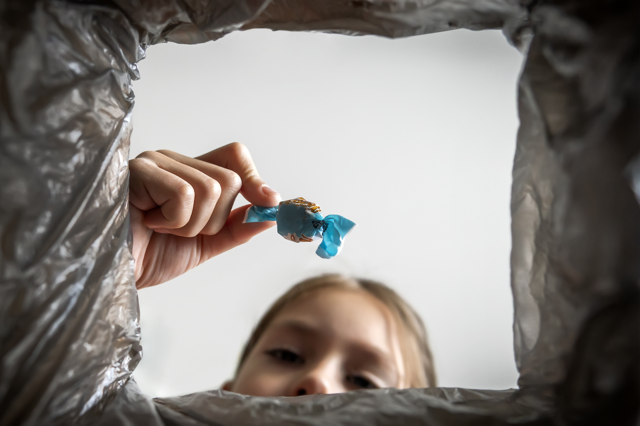 Image of Girl Throwing Away Candy | Halloween Candy