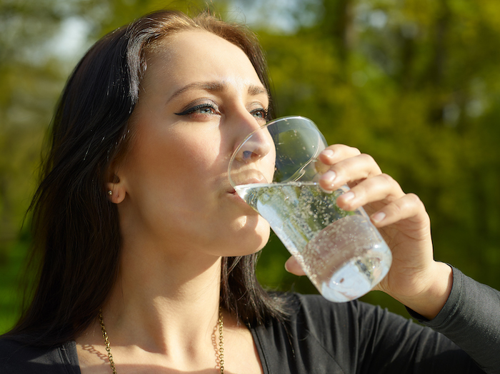 woman drinking seltzer water | La Croix Water Bad