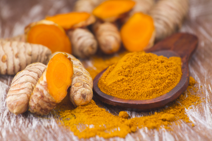 Close Up Shot of Turmeric Root and Powder | Healthy Spices
