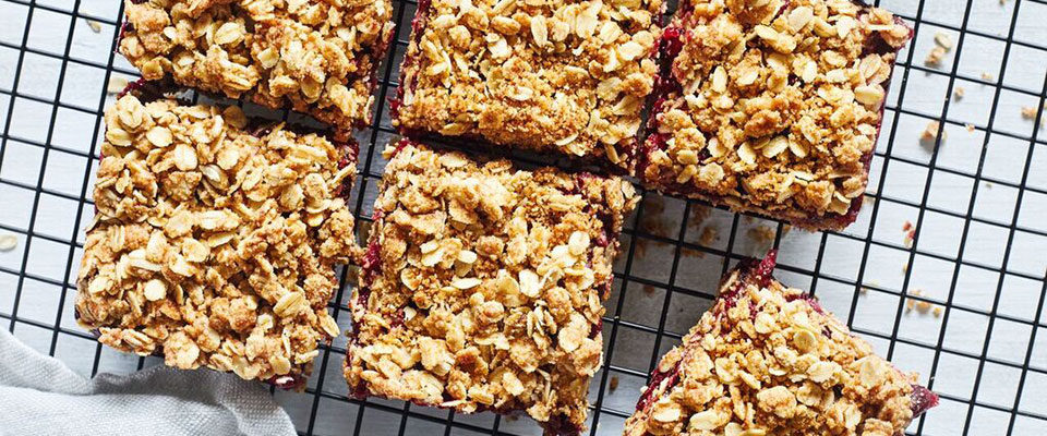 These mouthwatering Cranberry Crumble Bars feature a sweet and tart cranberry orange filling on a dense pastry crust topped with crisp oats.