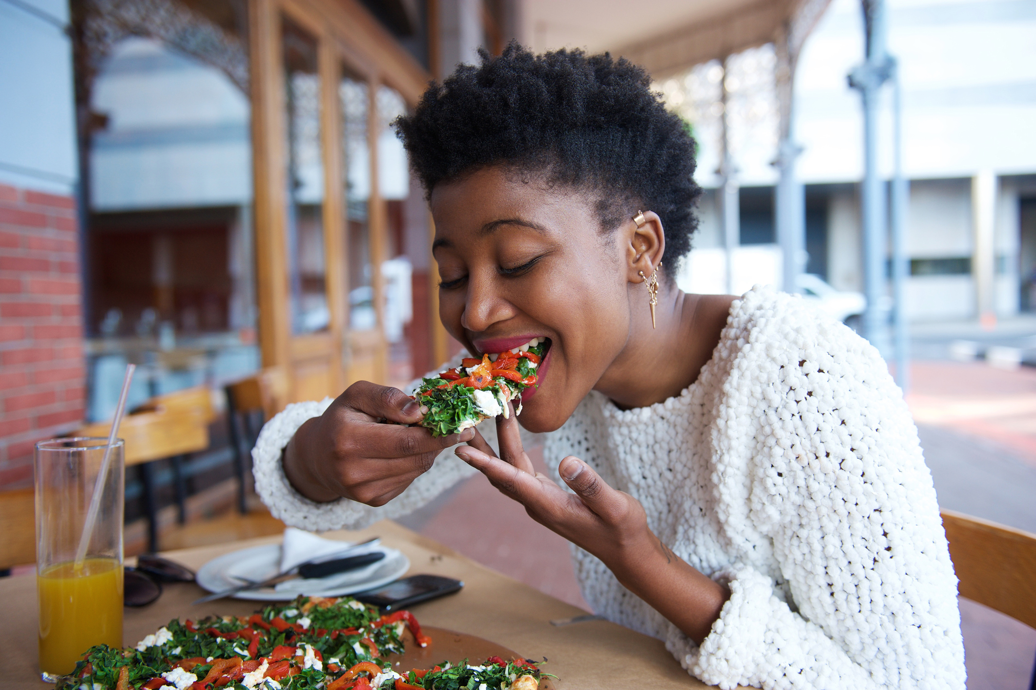 Women Savors Bite of Pizza | Mindfulness Tips