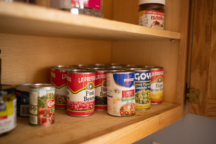 Cupboard full of canned food | Cooking For One