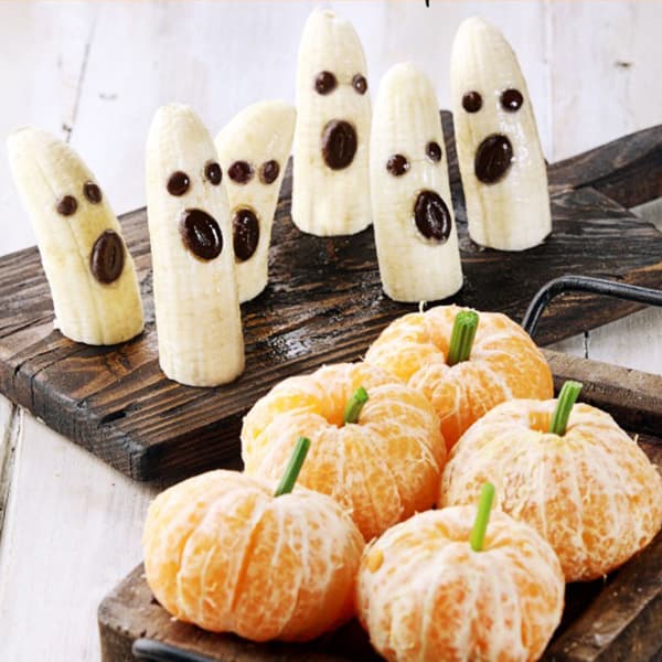 Banana ghosts and clementine pumpkins Halloween Snack