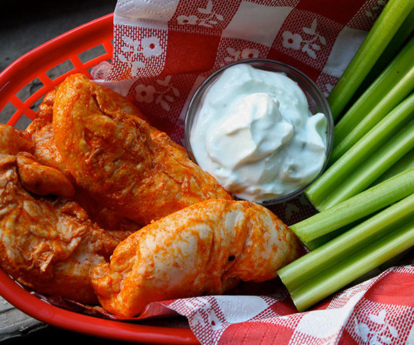 Buffalo chicken tenders with celery and blue cheese sauce