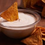 This creamy Vegan Queso Sauce doesn't contain an ounce of cheese but features nutty cashews, nutritional yeast, smoked paprika, and a hint of chili powder.