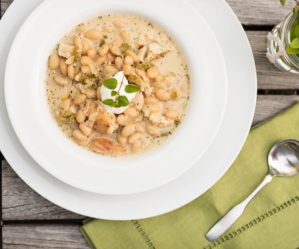 Tender leeks, freshly chopped sage, and hearty cannellini beans give this Chicken and White Bean Soup a deep aroma and rich flavor profile.