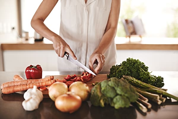 Woman chopping vegetables