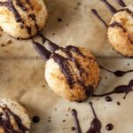 These simple elegant Coconut Macaroons feature wholesome ingredients like unsweetened shredded coconut and dark chocolate morsels.