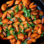 This recipe for Caramelized Carrots with Curry Spice features pungent curry powder, coarsely chopped cilantro leaves, with a touch of salt and pepper.