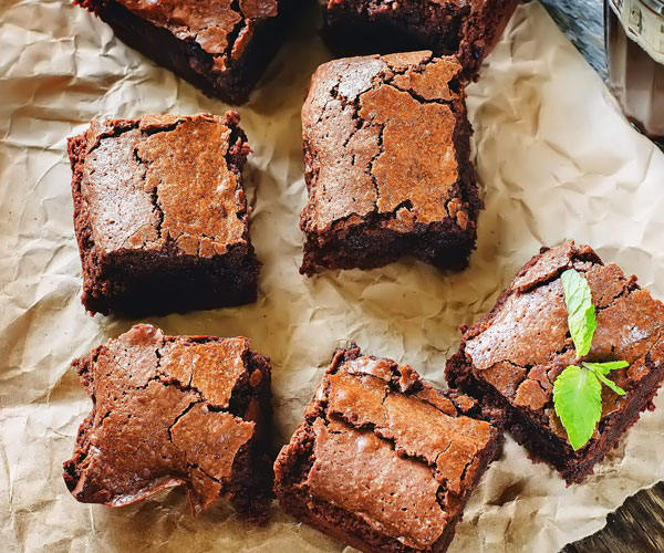 fudgy brownies on parchment paper