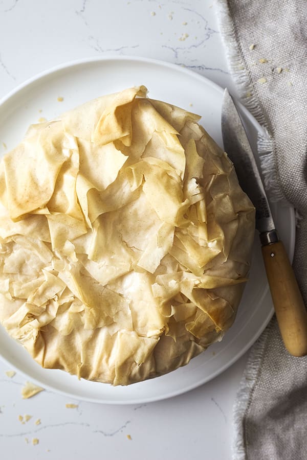 Our Spanikopita, or Greek Spinach pie, is a rich pastry stuffed with spinach and cheese. featuring healthier phyllo dough, onion, and crumbled feta.