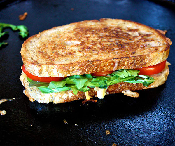 This healthier Smoked Gouda Grilled Cheese sandwich has bold roasted red peppers, creamy Dijon mustard, fresh arugula, and smoked gouda cheese.