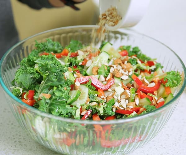 Raw kale and brussels sprouts salad with almonds