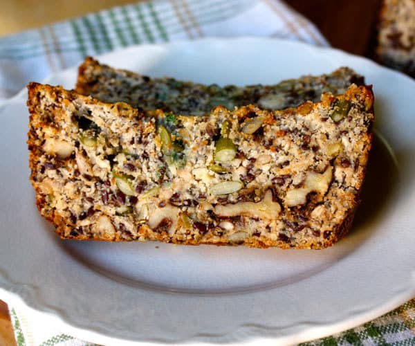 Super seeded paleo-friendly bread with pumpkin seeds, flax seeds, and walnuts