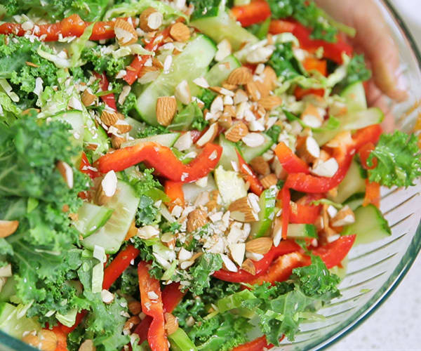 Raw kale and brussels sprouts salad with almonds