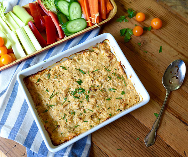 To make this healthier Buffalo Chicken Dip, we've combined cayenne pepper hot sauce with two creamy cheeses, and yummy blue cheese crumbles.