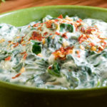 This delicious, healthier features baby spinach, freshly squeezed lemon juice, finely chopped garlic, and reduced-fat Greek yogurt.